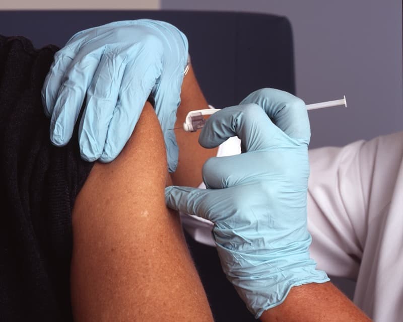 Medical professional providing skilled injection procedure