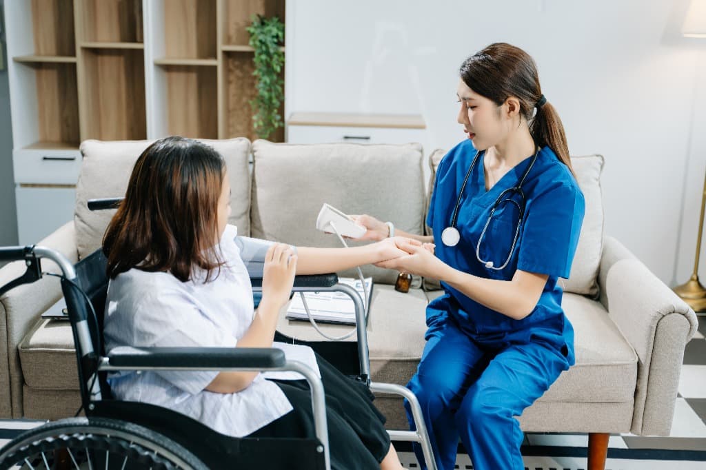 Nurse checking blood pressure during private duty nursing care
